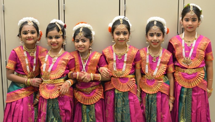 Beautiful Smiling indian girls give pose for Photo shoot before Dance performance of Bharatanatyam